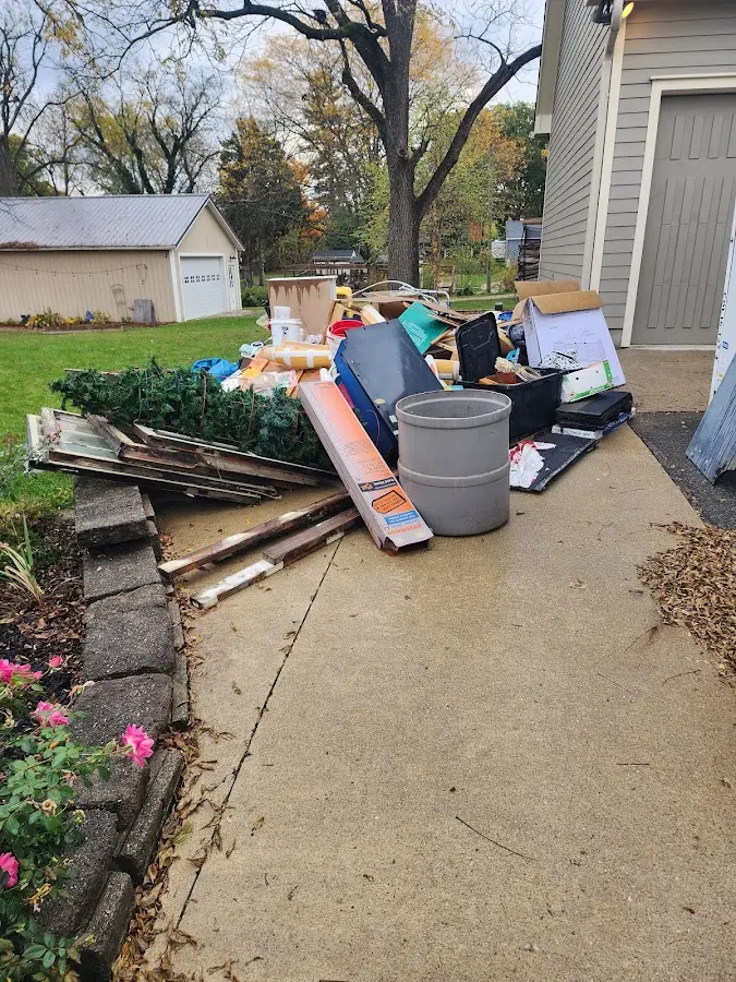 Dumpster being loaded with debris for 3 Yard Dumpster Rental in Chatham